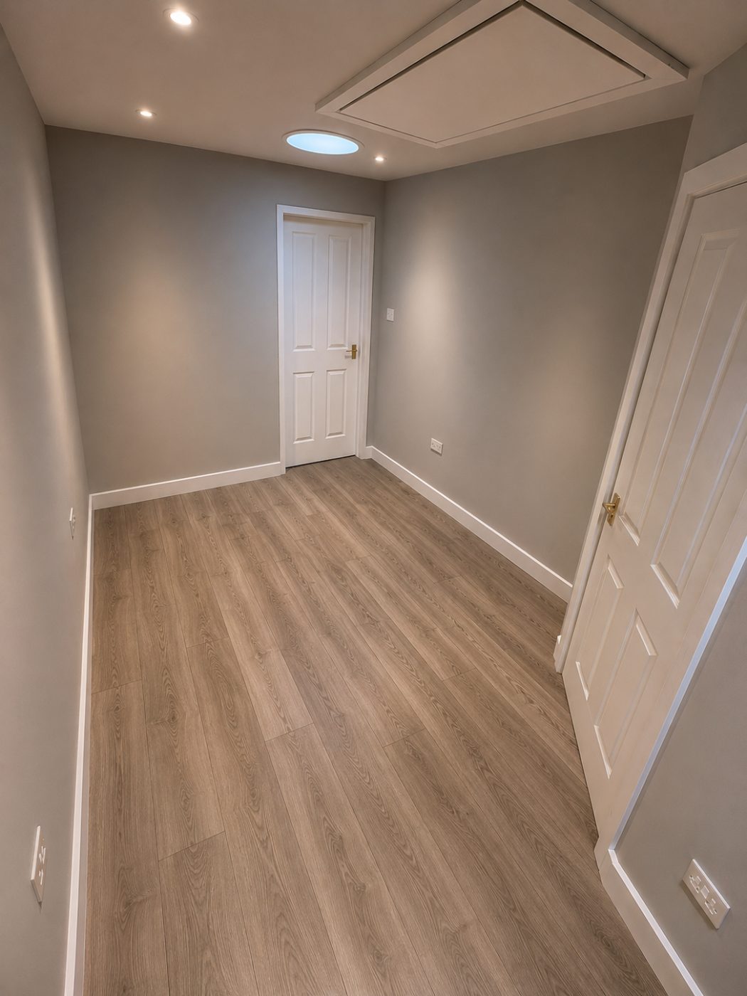Finished room with a new white door, skirting and flooring